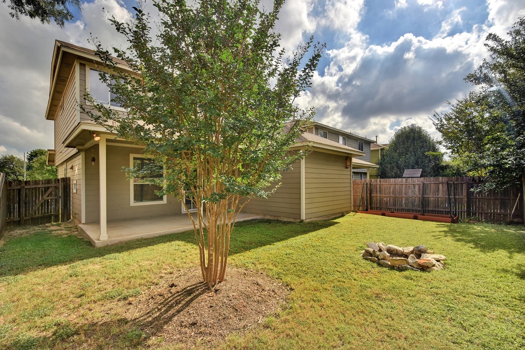 2201 Keepsake Drive Austin, TX 78745 - Photo 22 of 25 a view of a backyard with a tree
