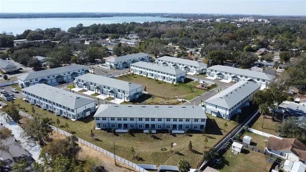 an aerial view of a house with a ocean view