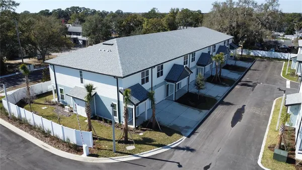 a view of a couches and dinning table in patio