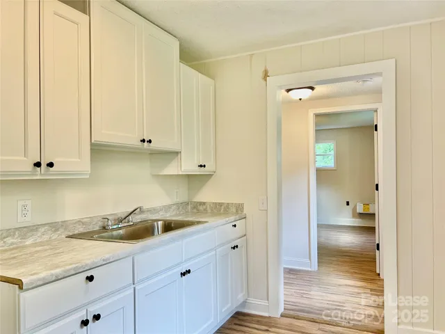 a kitchen with a sink and cabinets