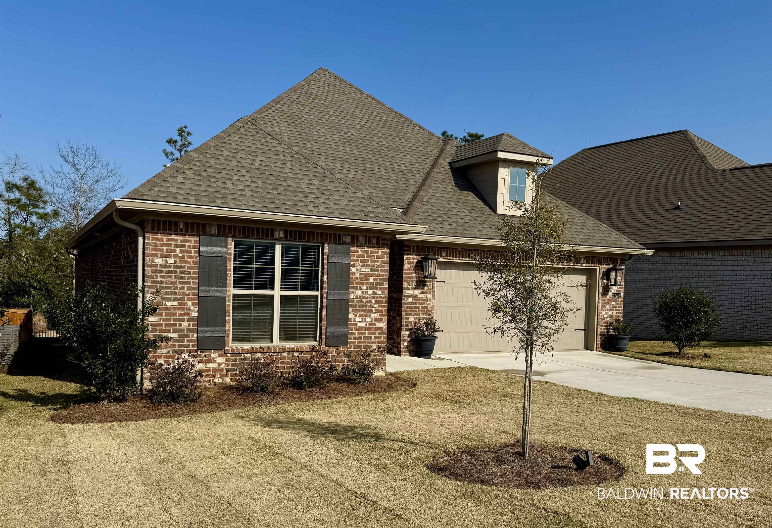 31748 Canopy Loop Spanish Fort, AL 36527 - Photo 1 of 22 View of front of house with a garage and a front lawn