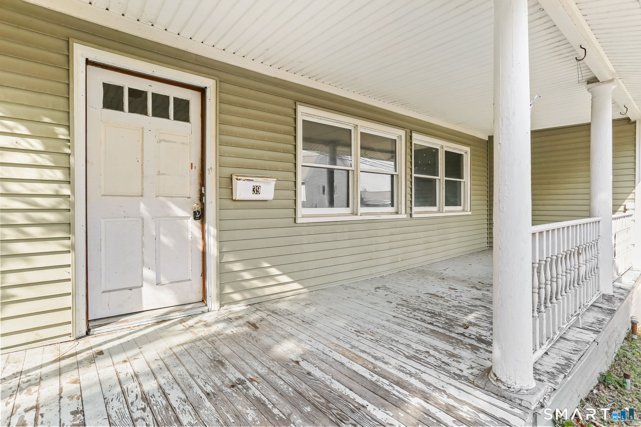 39 Soundview Avenue Milford, CT 06460 - Photo 4 of 18 a view of a house with a door and wooden floor