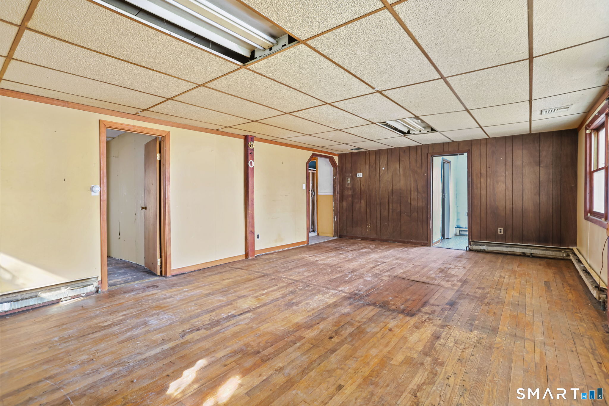 39 Soundview Avenue Milford, CT 06460 - Photo 5 of 18 a view of empty room with wooden floor