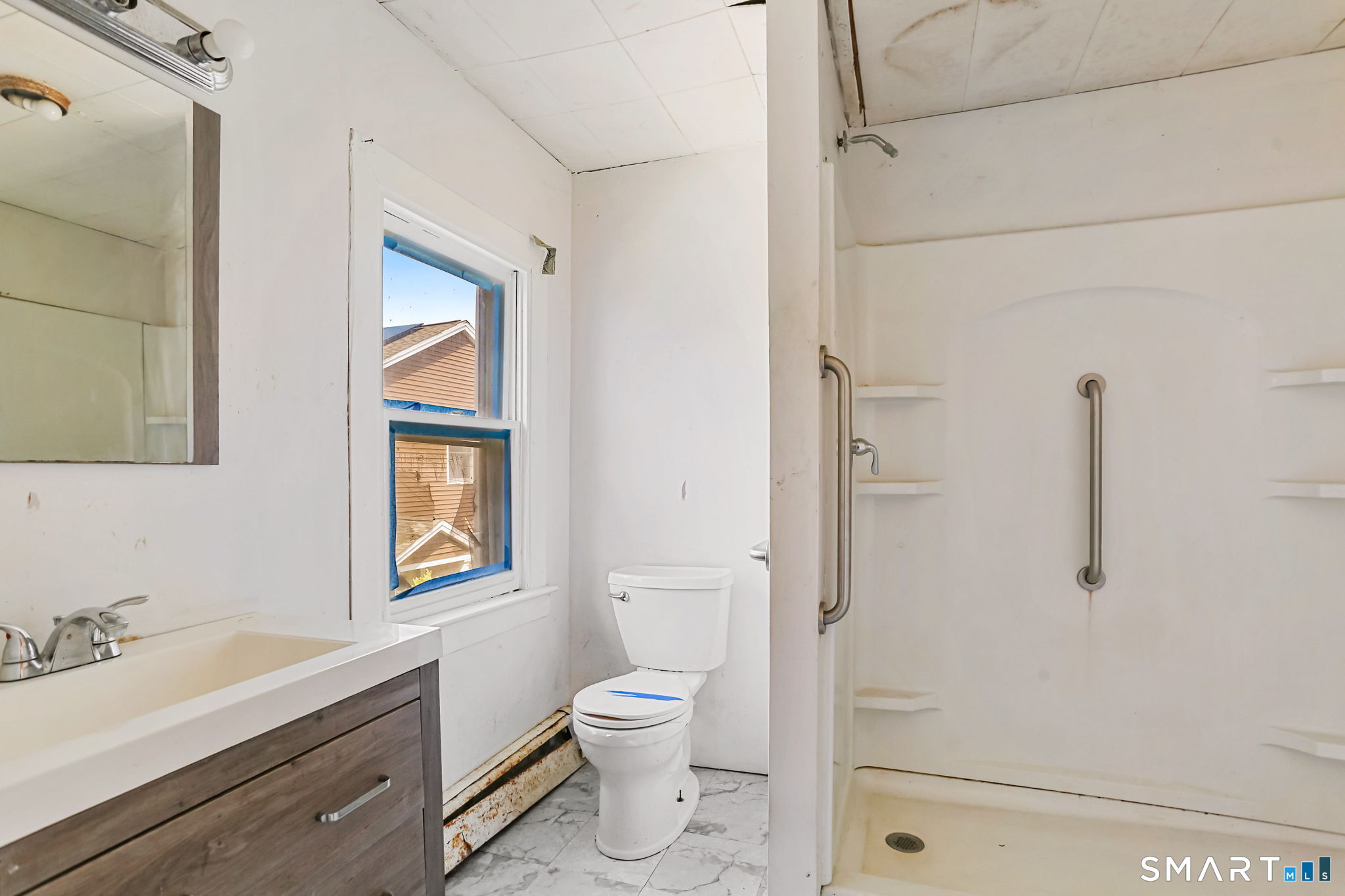 39 Soundview Avenue Milford, CT 06460 - Photo 10 of 18 a bathroom with a granite countertop toilet sink and shower