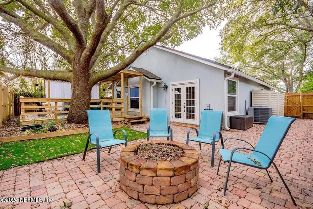 a backyard of a house with seating space