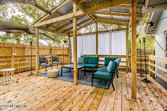 a view of a chairs and table in the patio