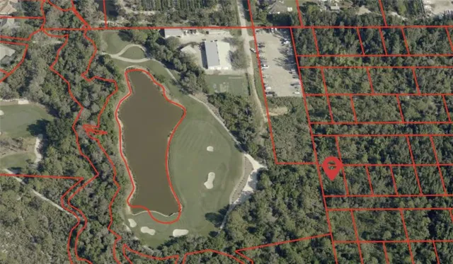 a view of a wooden fence and flowers in the background