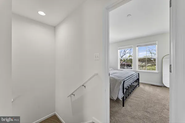 a room with a bed and a window