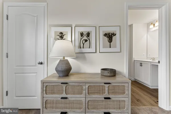 a view of hallway that has closet
