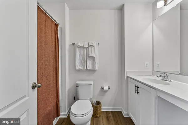 a white toilet sitting next to a bathroom sink