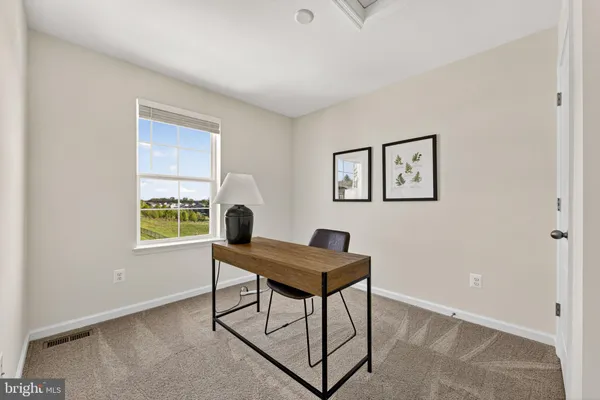 a workspace with furniture and window