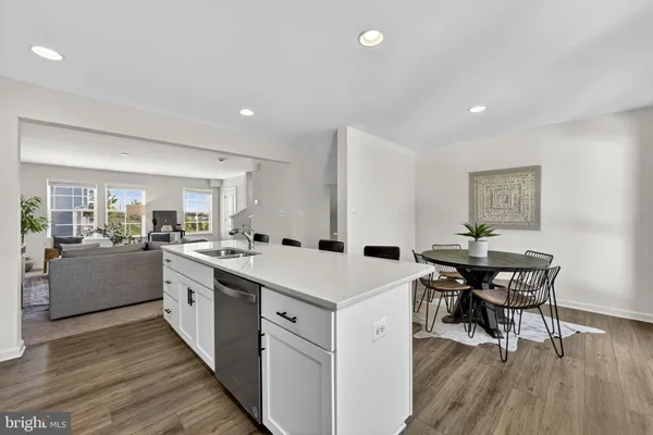 a kitchen with a table and chairs in it