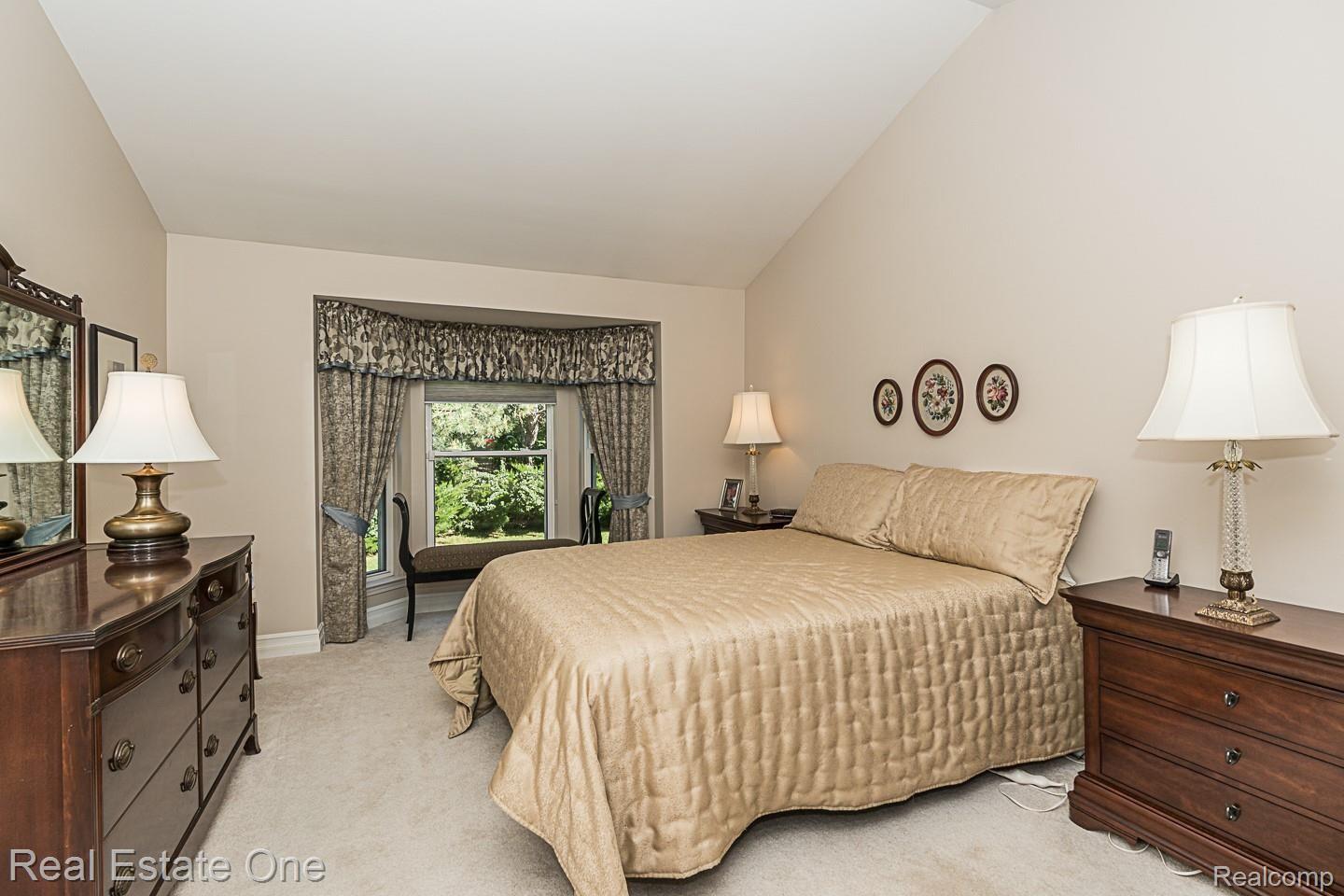 1054 Churchill Circle, Unit 26 Rochester, MI 48307 - Photo 16 of 29 Master Bedroom with Bay window( New Ordered window treatment, will be coming in soon.