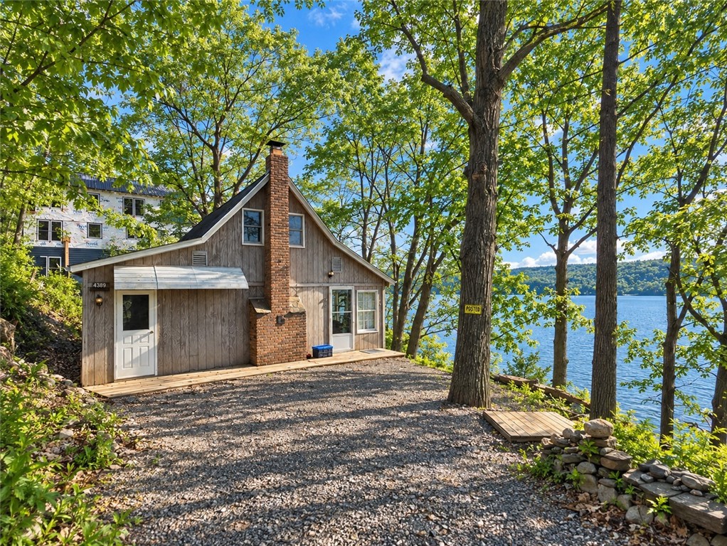 4389 Mickel Parcel A Road Burdett, NY 14818 - Photo 1 of 13 Classic Seneca Lake Cottage Nestled Among the Trees with Beautiful Lake Views