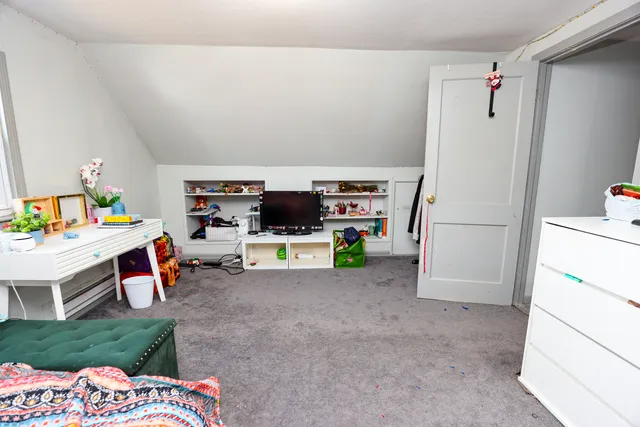 a room with a bed and a chair