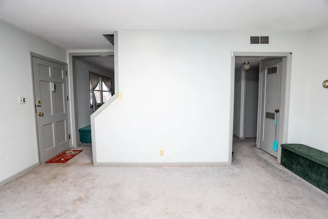 a kitchen with stainless steel appliances kitchen island granite countertop a sink and cabinets