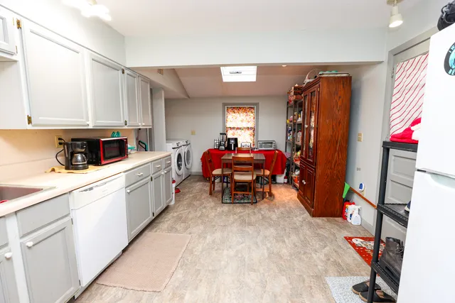 a kitchen with stainless steel appliances granite countertop a sink and cabinets