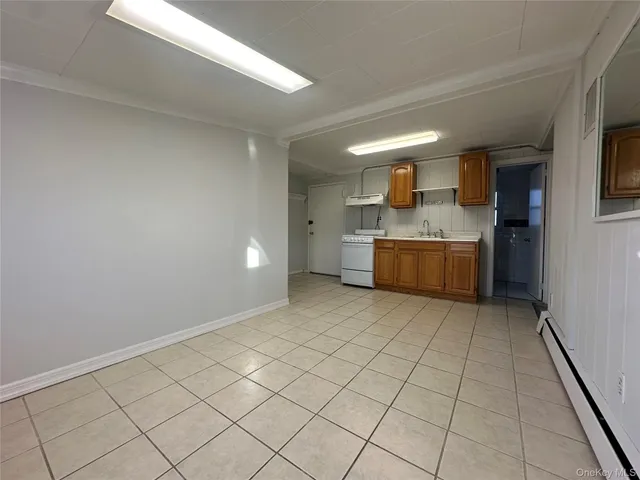 a room with a wooden floor and washing machine