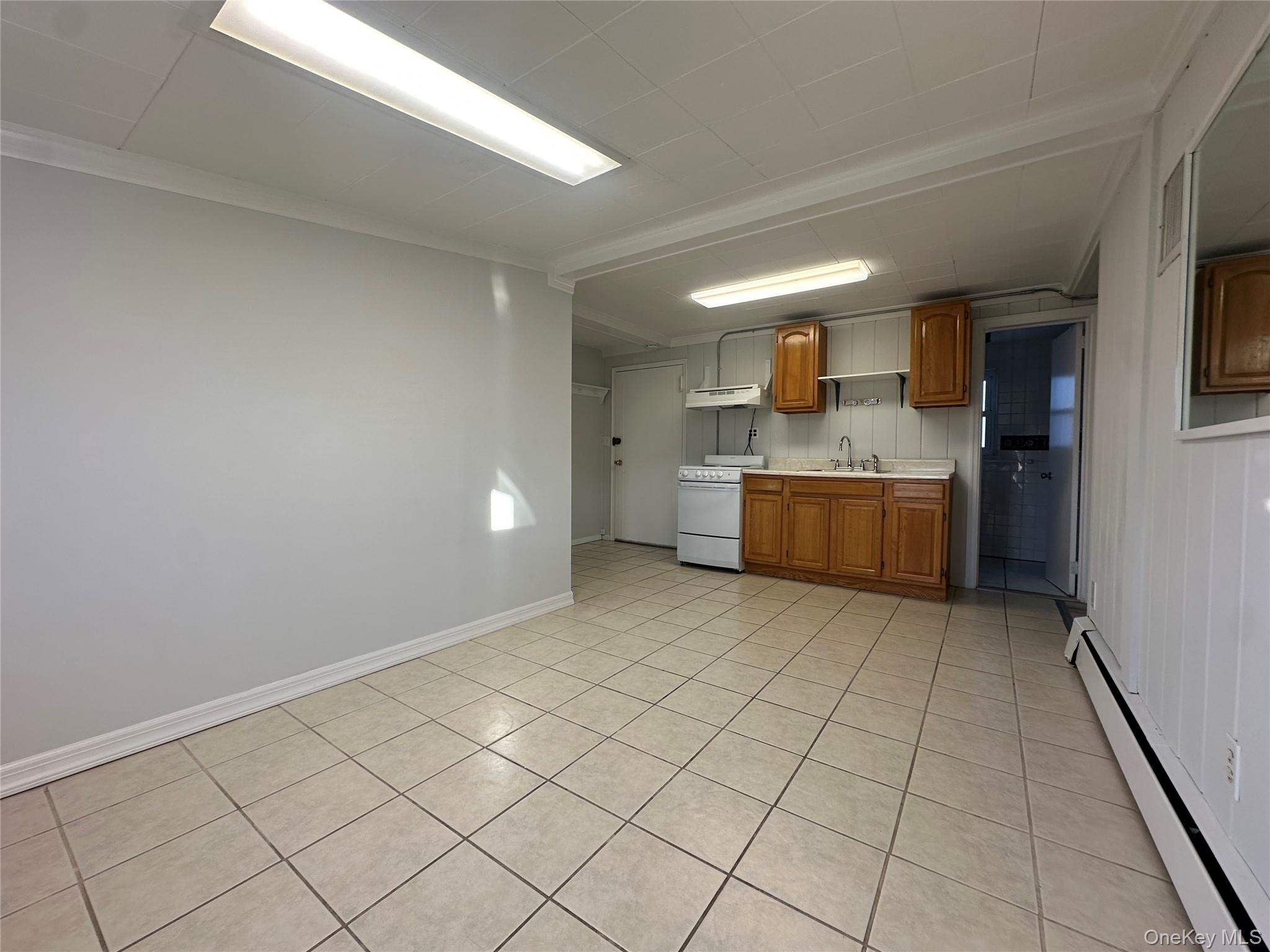 a room with a wooden floor and washing machine