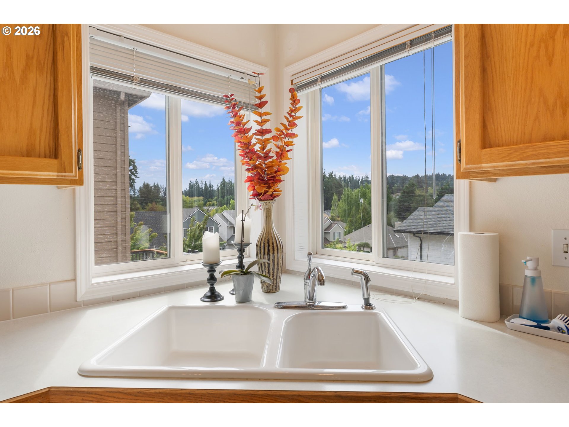 8943 Southwest 149th Place Beaverton, OR 97007 - Photo 12 of 41 a living room with a large window and a table