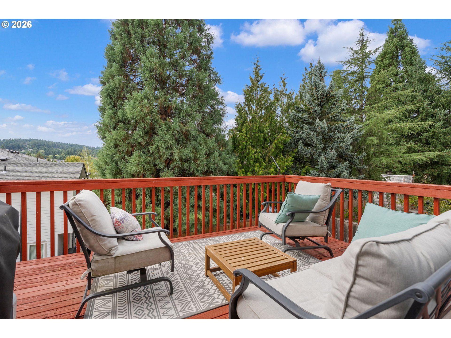 8943 Southwest 149th Place Beaverton, OR 97007 - Photo 17 of 41 a balcony with wooden floor and outdoor seating
