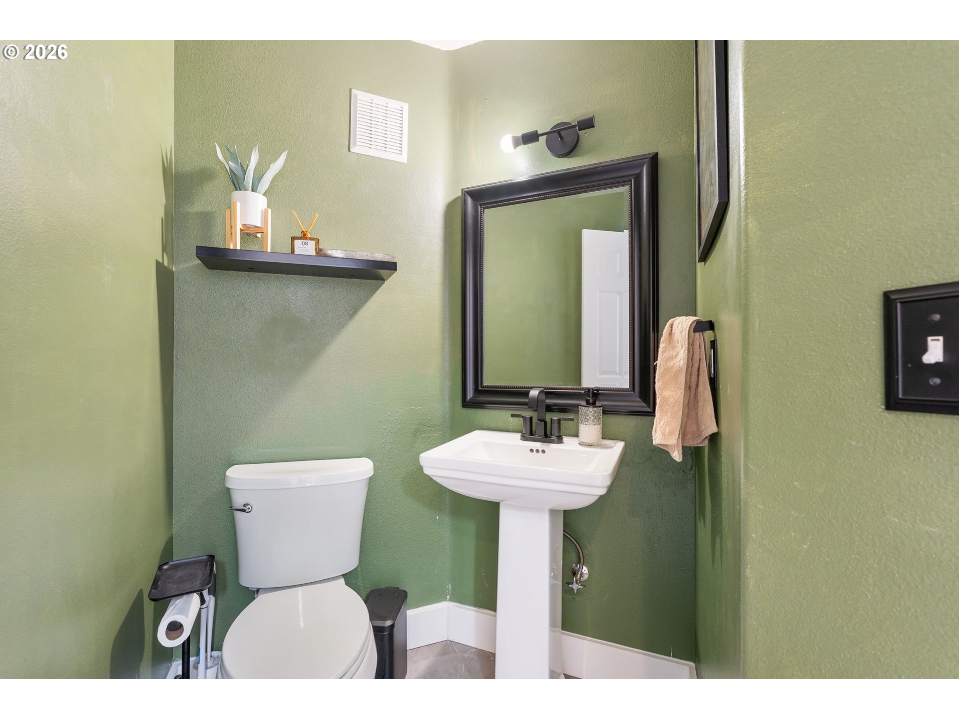 8943 Southwest 149th Place Beaverton, OR 97007 - Photo 19 of 41 a bathroom with a toilet sink and mirror