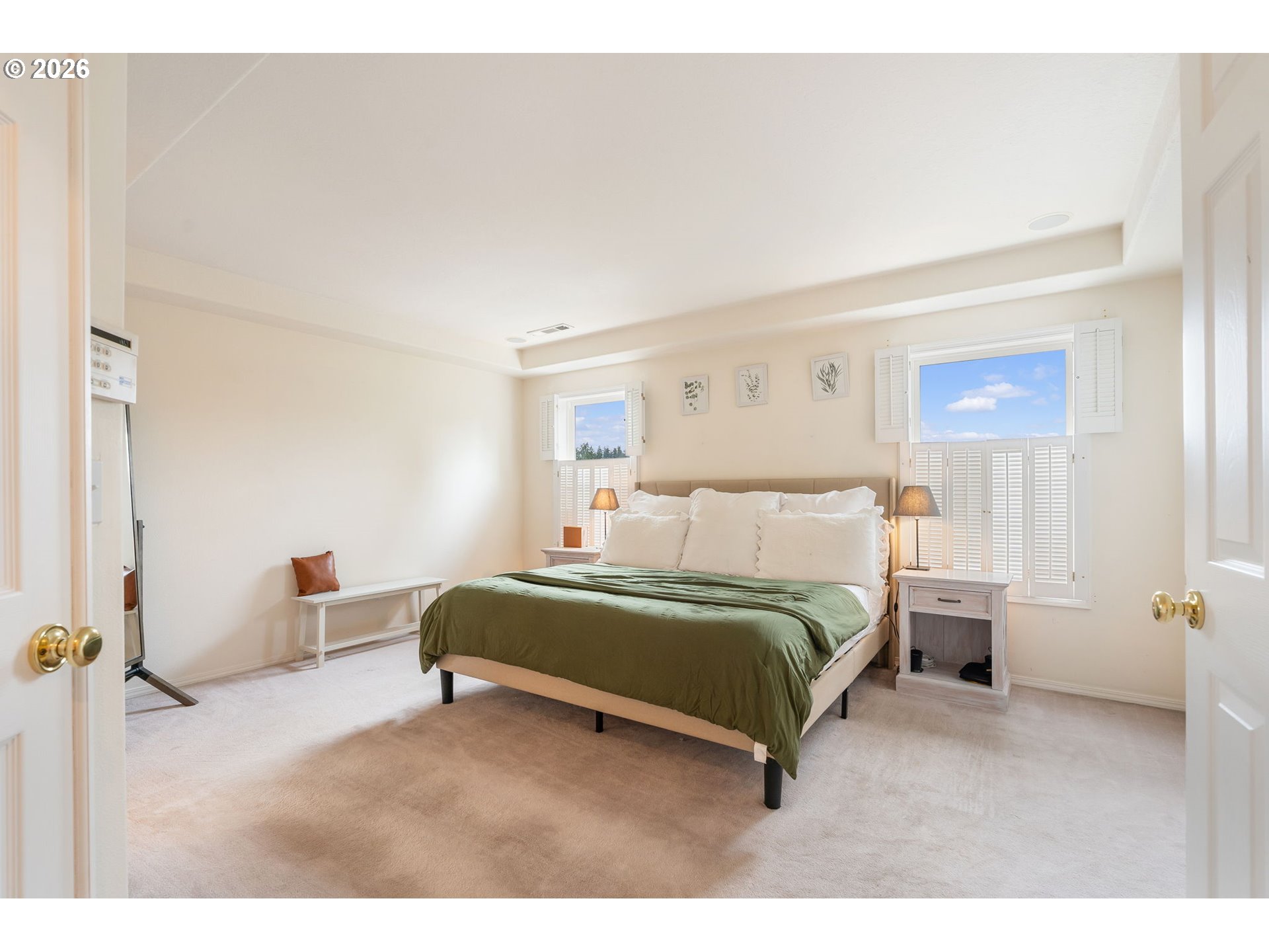 8943 Southwest 149th Place Beaverton, OR 97007 - Photo 22 of 41 a spacious bedroom with a bed and cabinets
