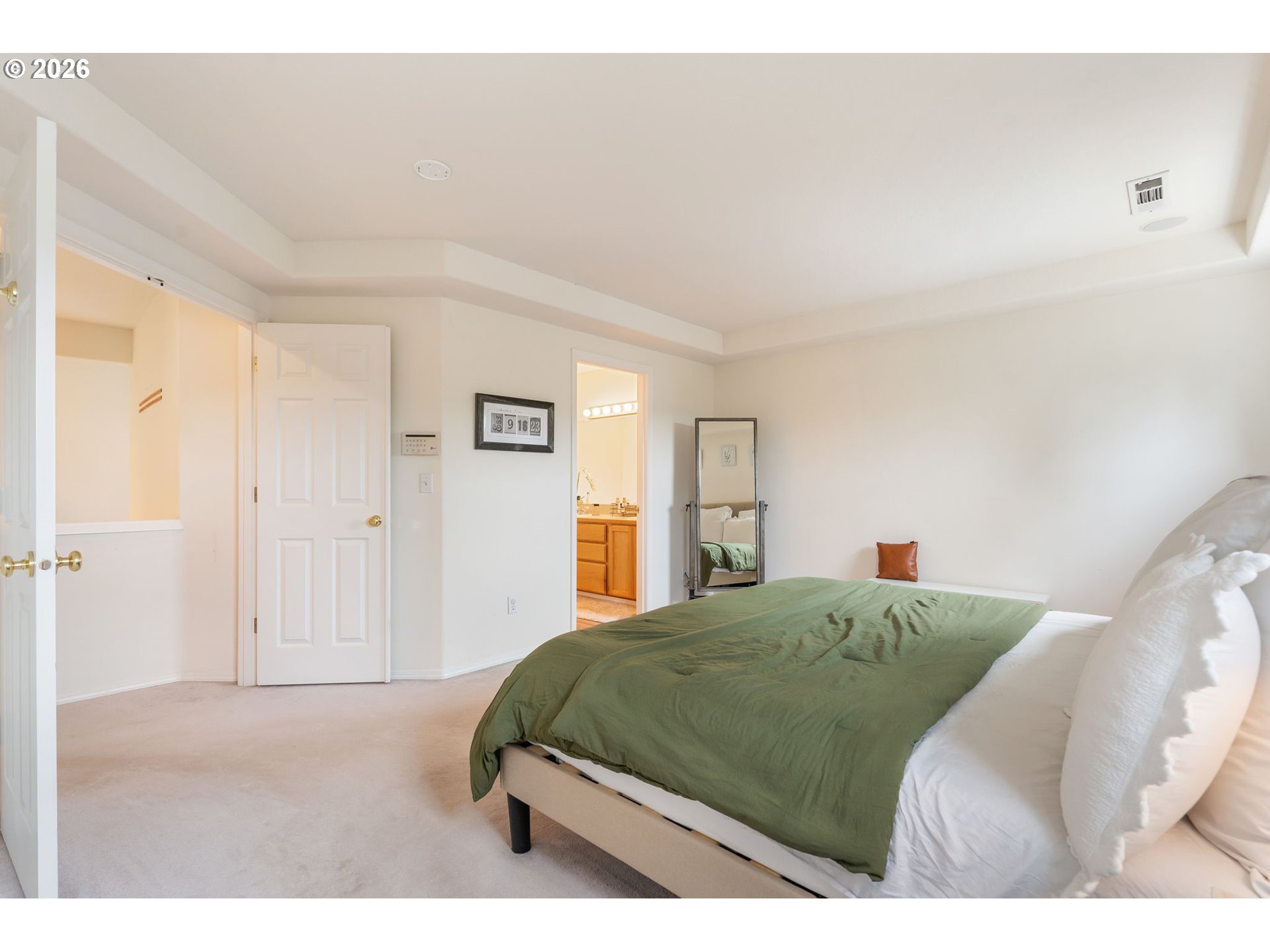 8943 Southwest 149th Place Beaverton, OR 97007 - Photo 23 of 41 a bedroom with a bed and a painting