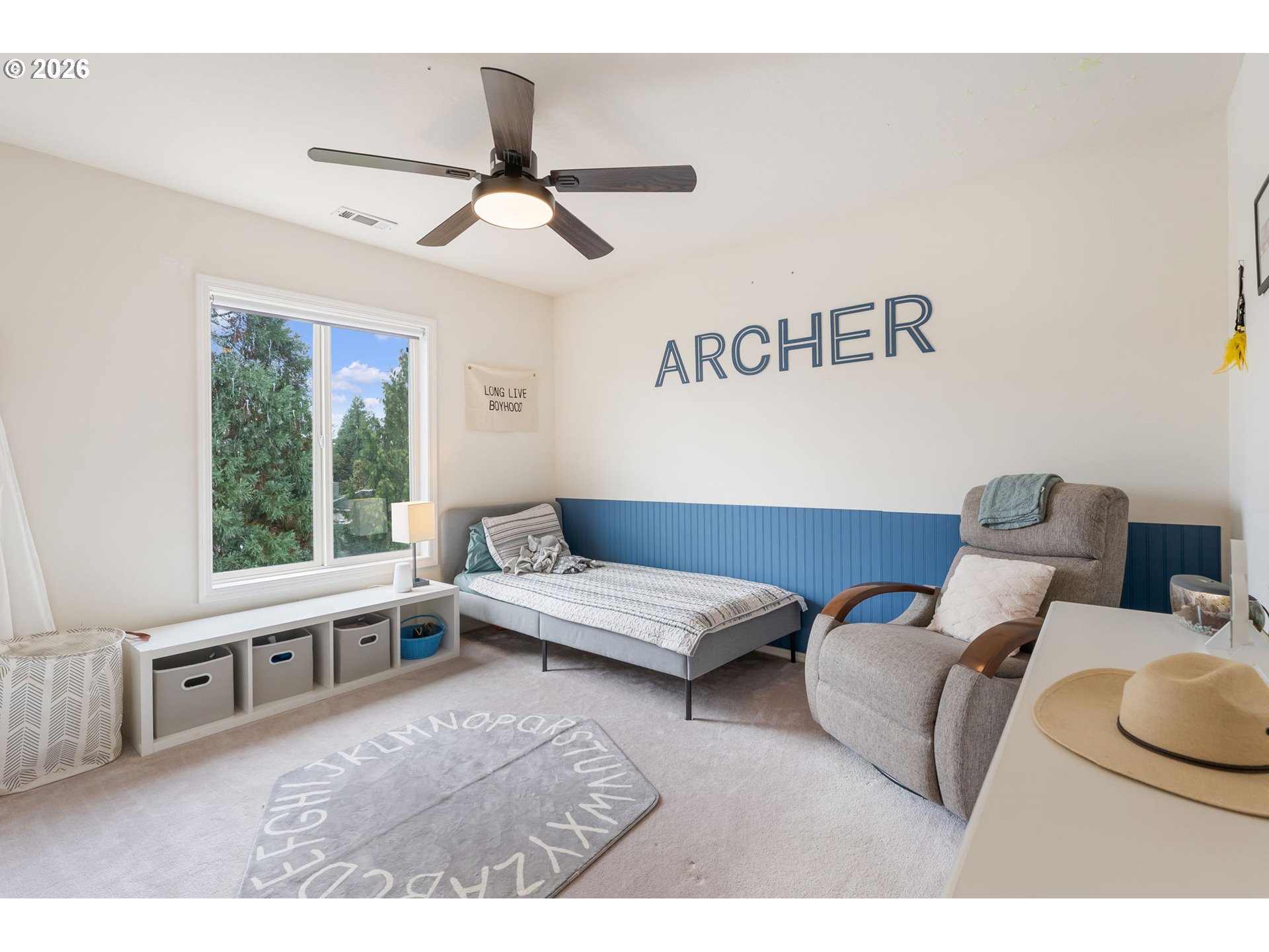8943 Southwest 149th Place Beaverton, OR 97007 - Photo 27 of 41 a living room with furniture and a large window
