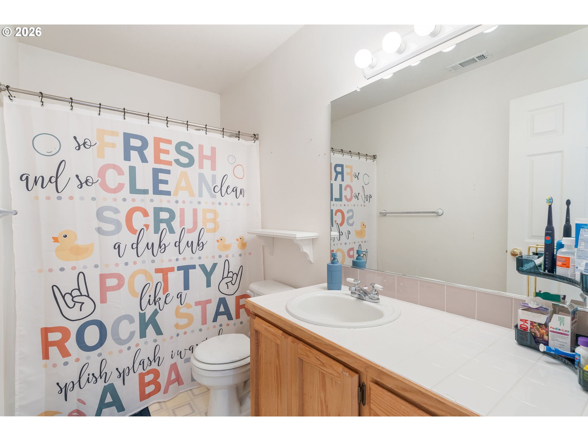 8943 Southwest 149th Place Beaverton, OR 97007 - Photo 31 of 41 a bathroom with a sink and a mirror