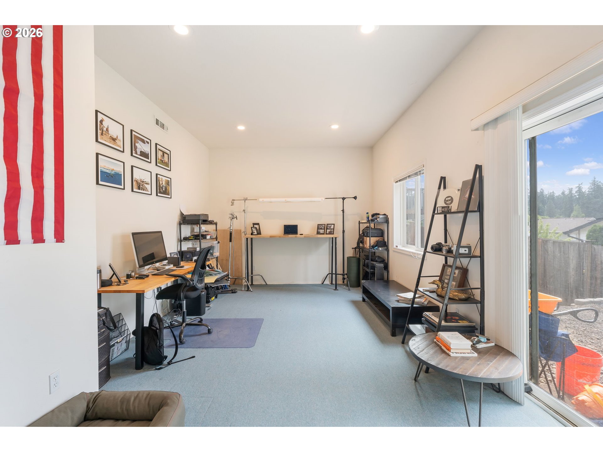 8943 Southwest 149th Place Beaverton, OR 97007 - Photo 33 of 41 a living room with lots of furniture and clutter