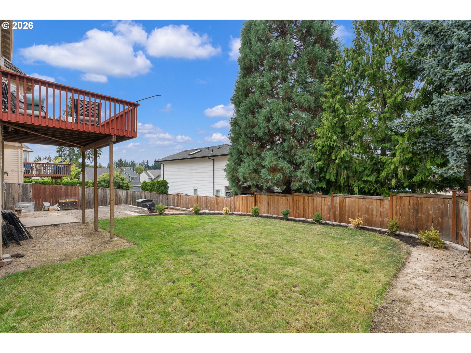 8943 Southwest 149th Place Beaverton, OR 97007 - Photo 37 of 41 a view of a house with a yard and sitting area