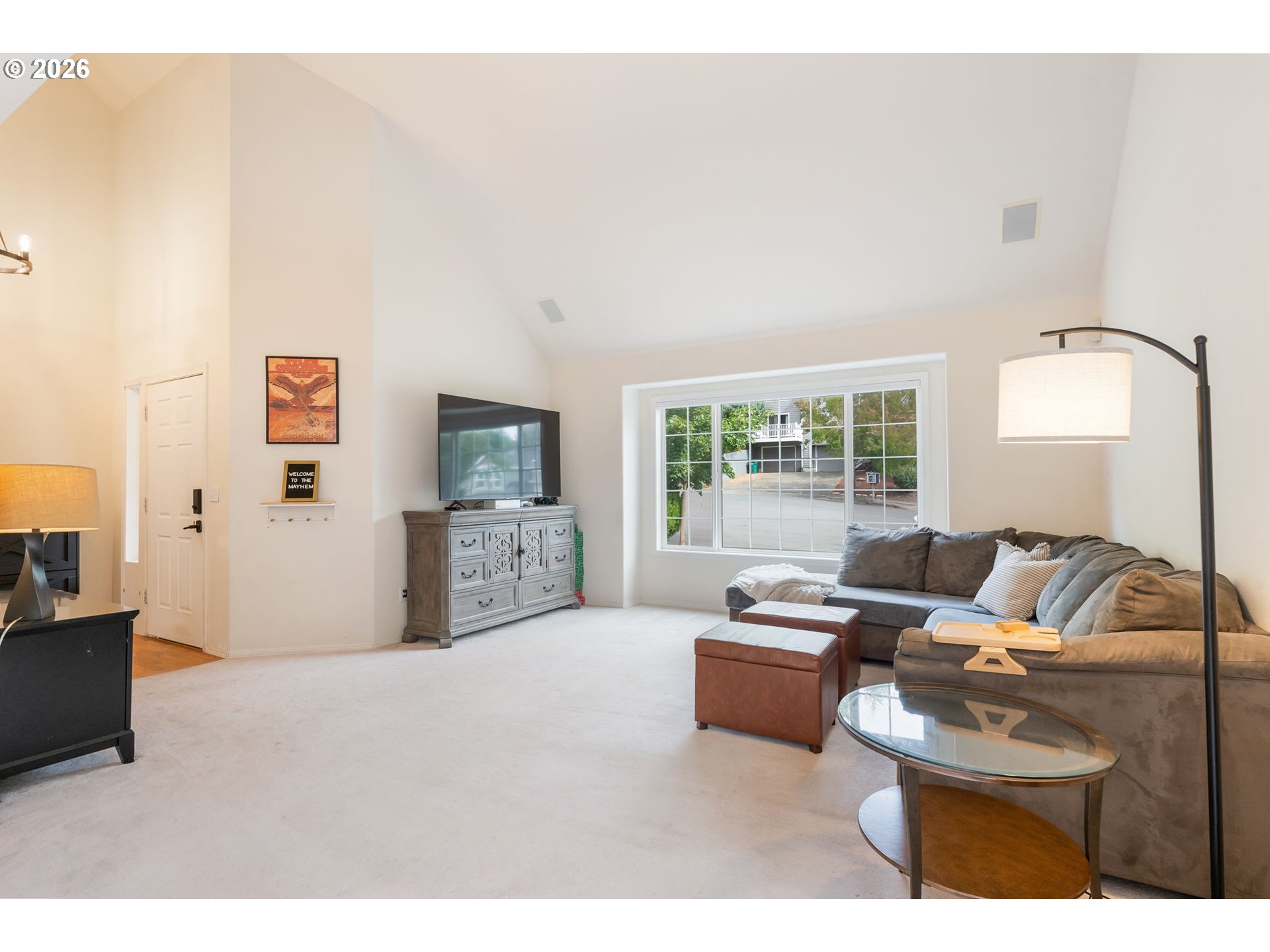 8943 Southwest 149th Place Beaverton, OR 97007 - Photo 4 of 41 a living room with furniture and a flat screen tv