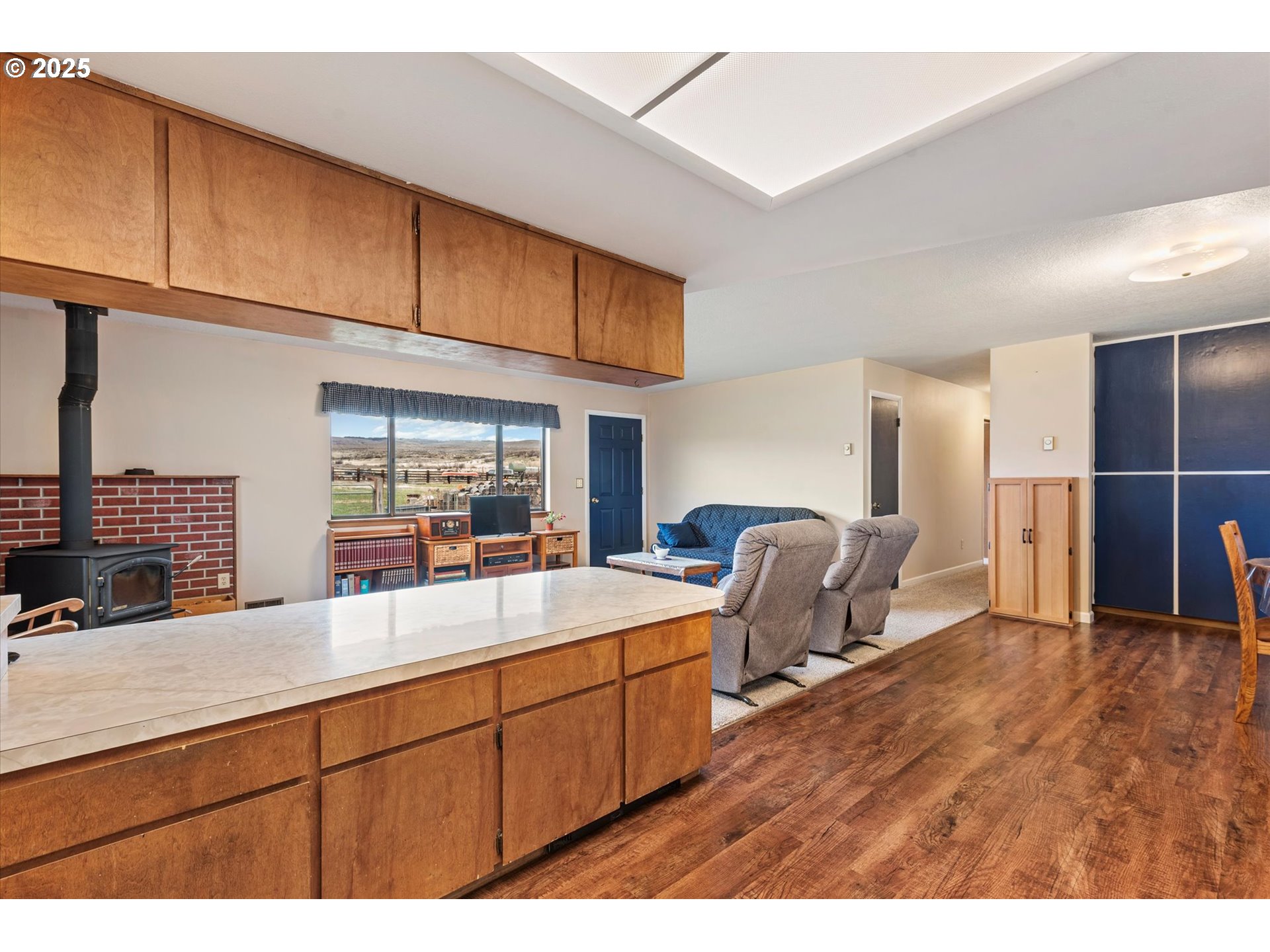 27877 Skinner Road Baker City, OR 97814 - Photo 16 of 48 a kitchen with stainless steel appliances kitchen island granite countertop a sink and cabinets