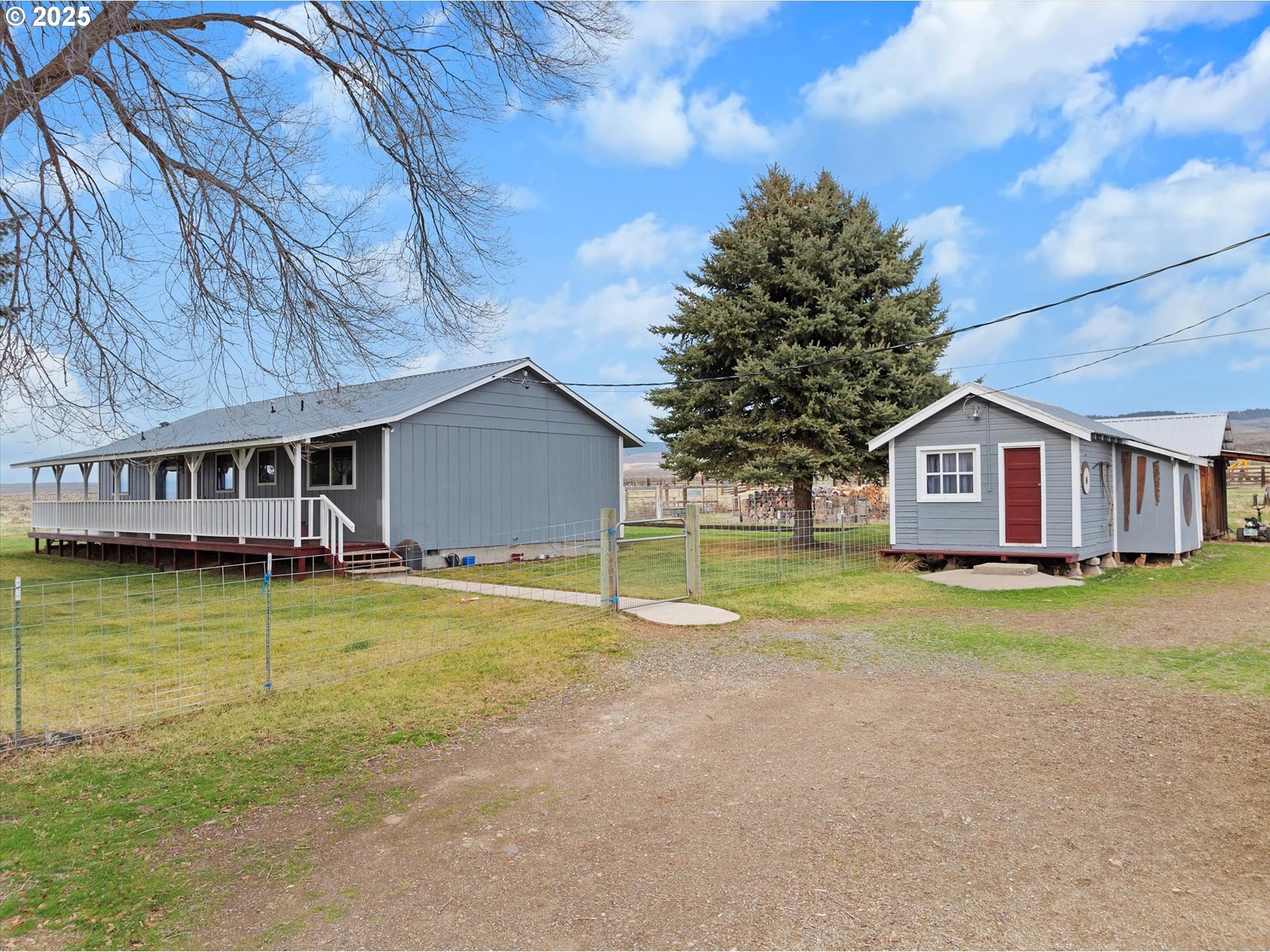 27877 Skinner Road Baker City, OR 97814 - Photo 2 of 48 a view of a house with pool and a big yard