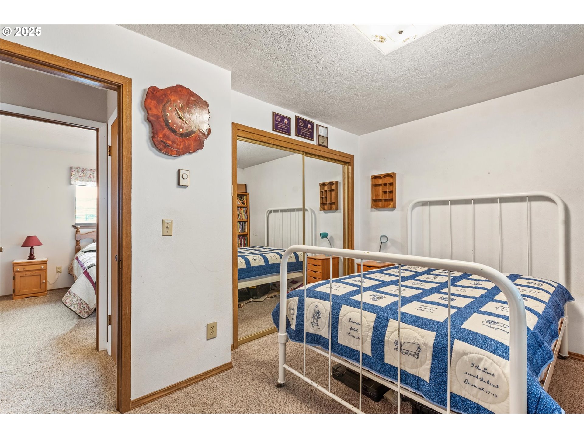 27877 Skinner Road Baker City, OR 97814 - Photo 22 of 48 a bedroom with a bed a dresser and chair