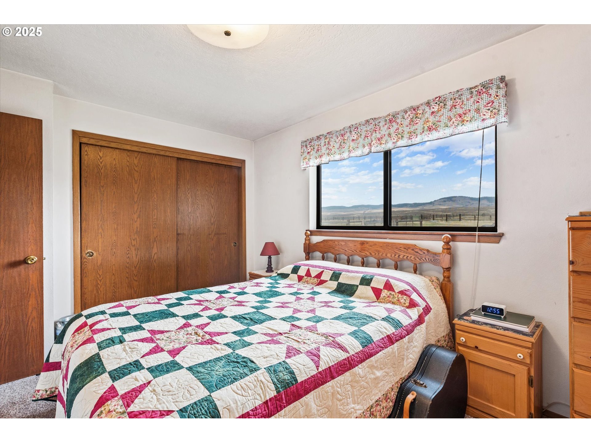27877 Skinner Road Baker City, OR 97814 - Photo 23 of 48 a bedroom with a bed and a flat screen tv