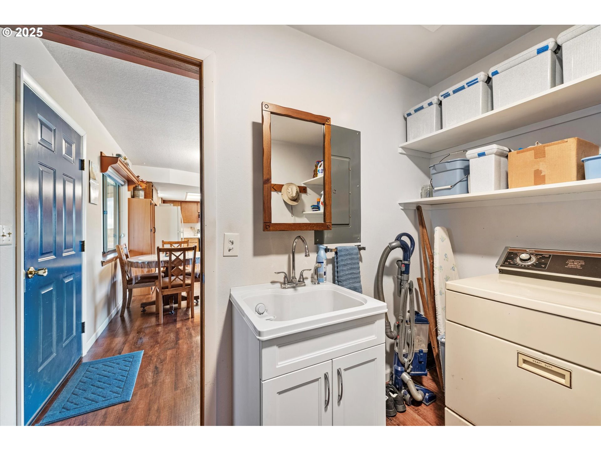 27877 Skinner Road Baker City, OR 97814 - Photo 24 of 48 a kitchen with a sink a refrigerator and chairs