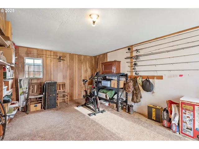 a bedroom with furniture and a book shelf