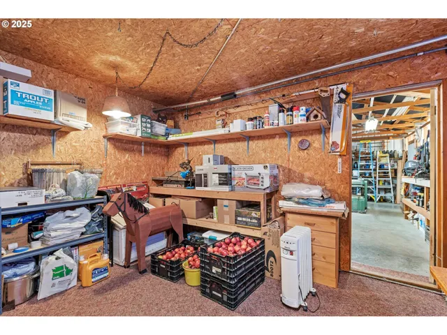 a kitchen with a sink cabinets and wooden floor