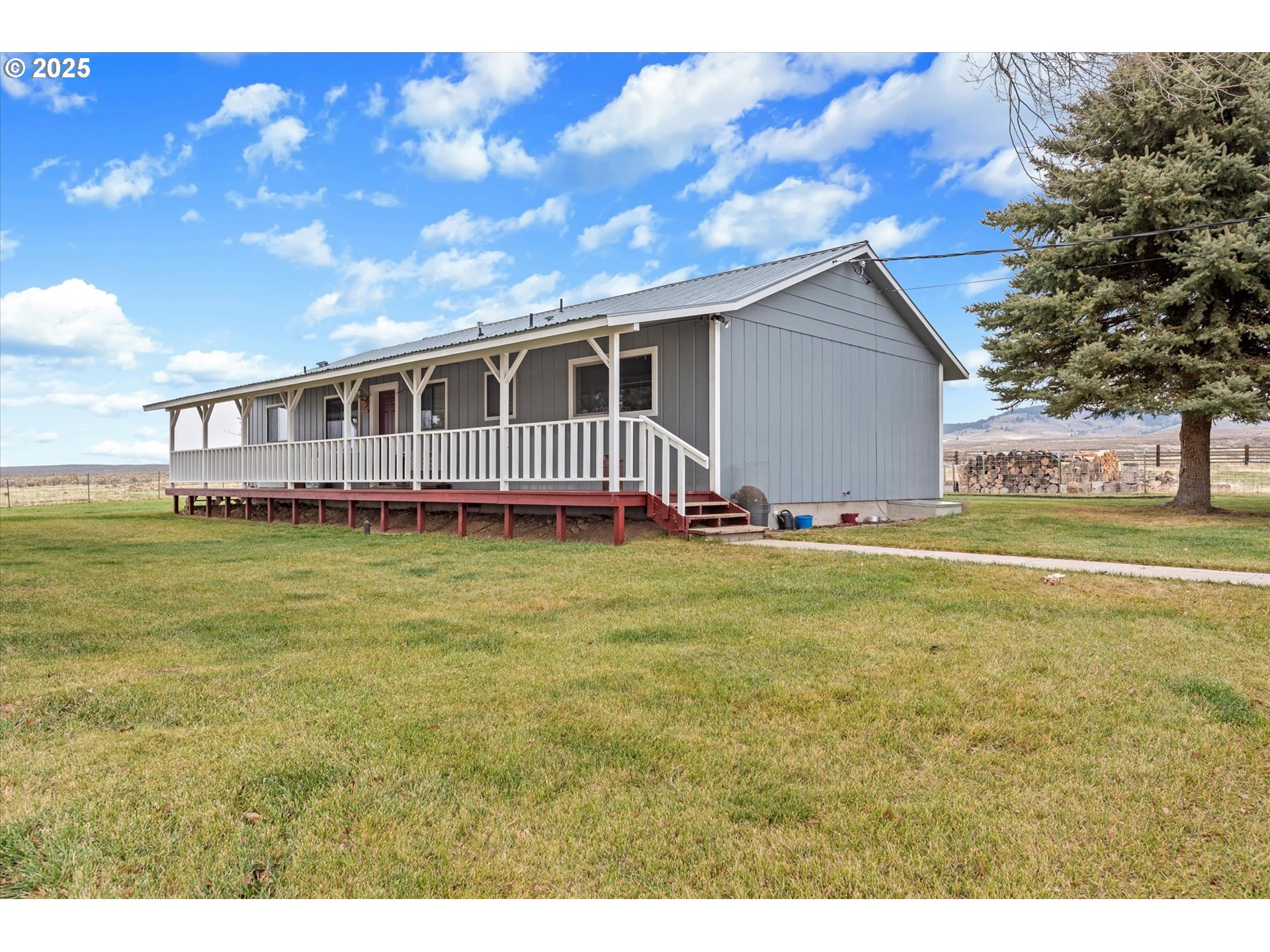 27877 Skinner Road Baker City, OR 97814 - Photo 6 of 48 a view of a house with a big yard