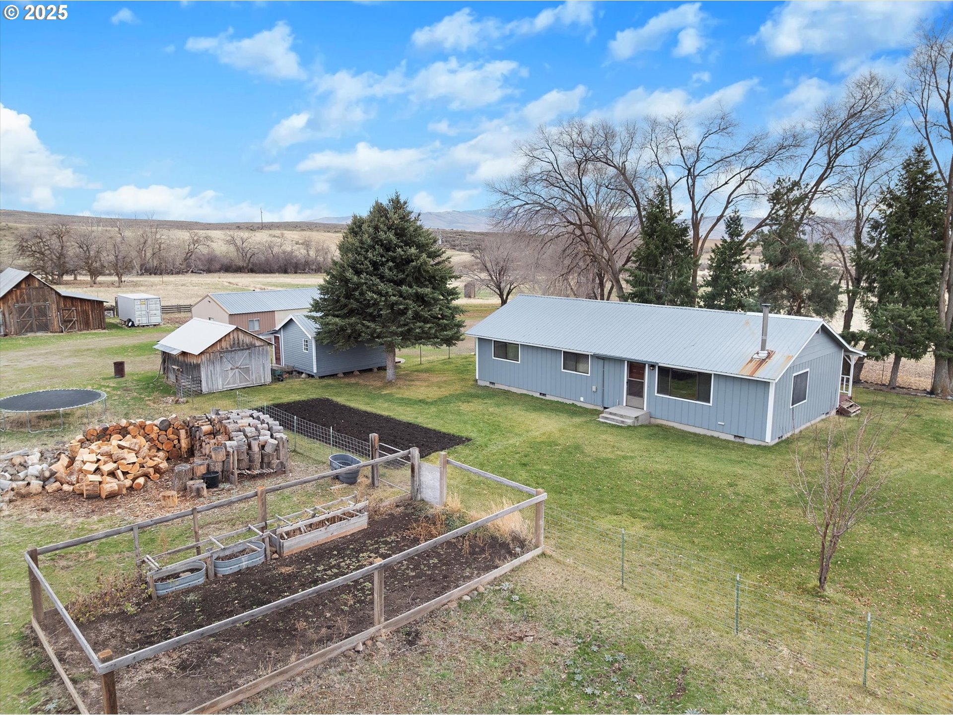 27877 Skinner Road Baker City, OR 97814 - Photo 7 of 48 a view of a house with a yard