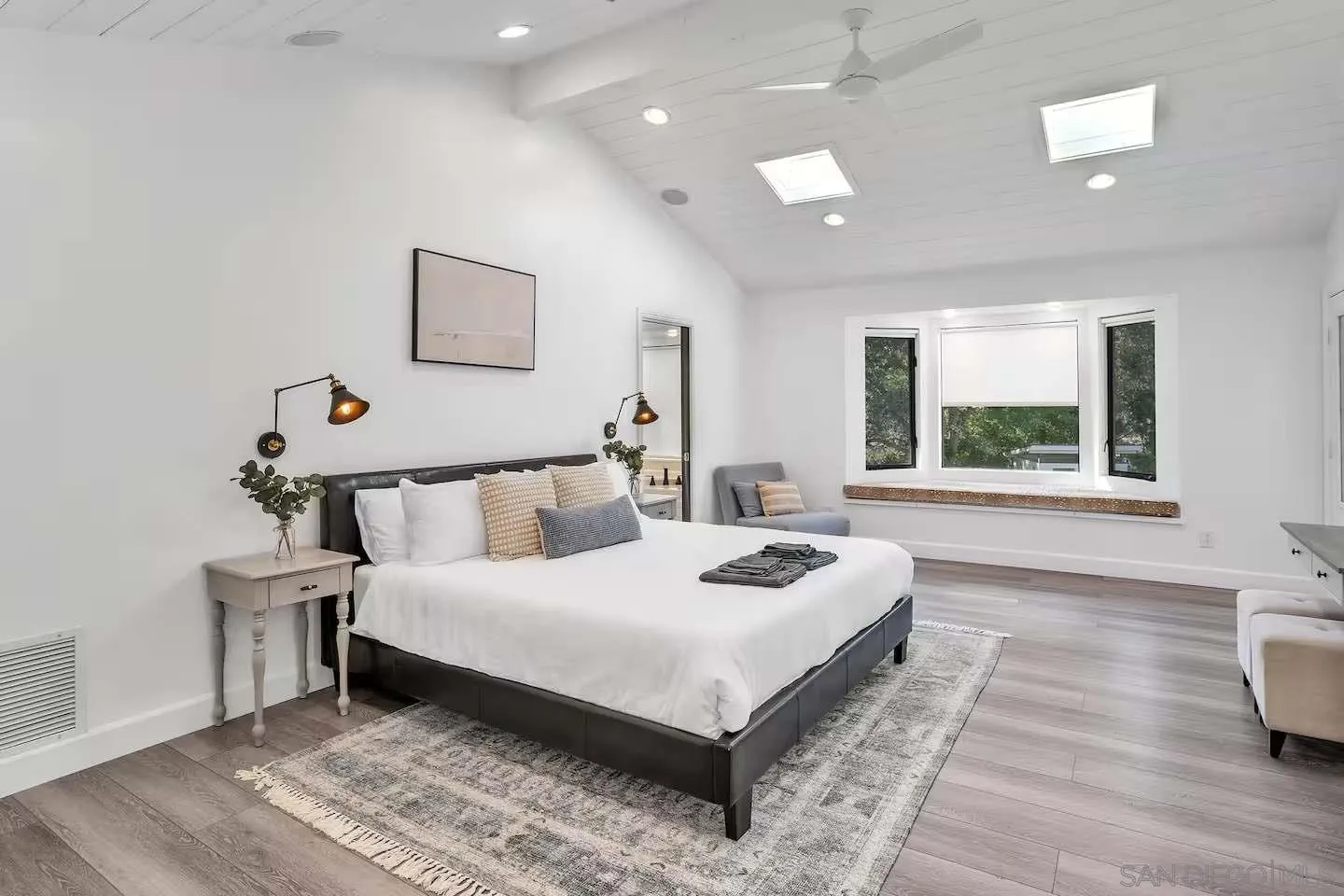 3550 Laketree Drive Fallbrook, CA 92028 - Photo 16 of 56 a large bedroom with a bed and wooden floor