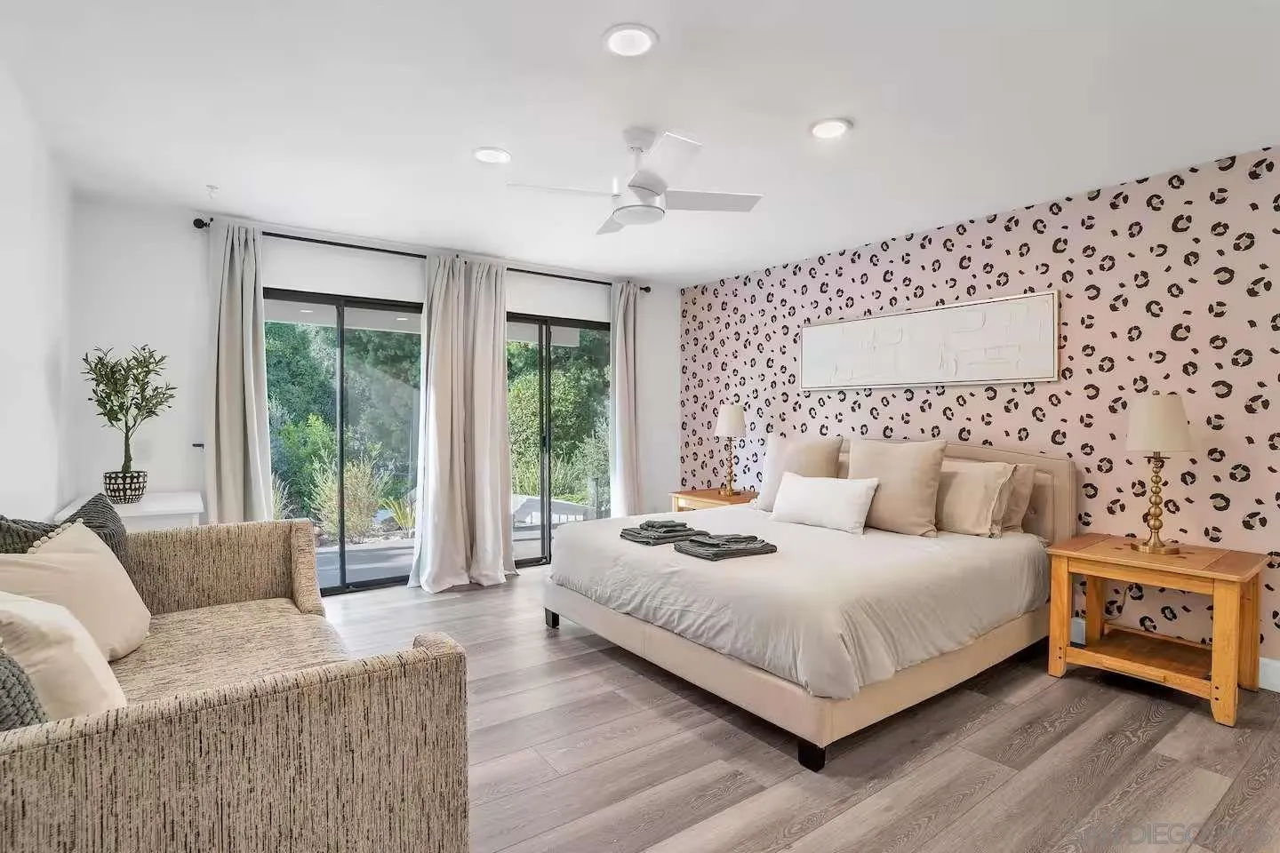 3550 Laketree Drive Fallbrook, CA 92028 - Photo 26 of 56 a bedroom with a bed couch and a large window