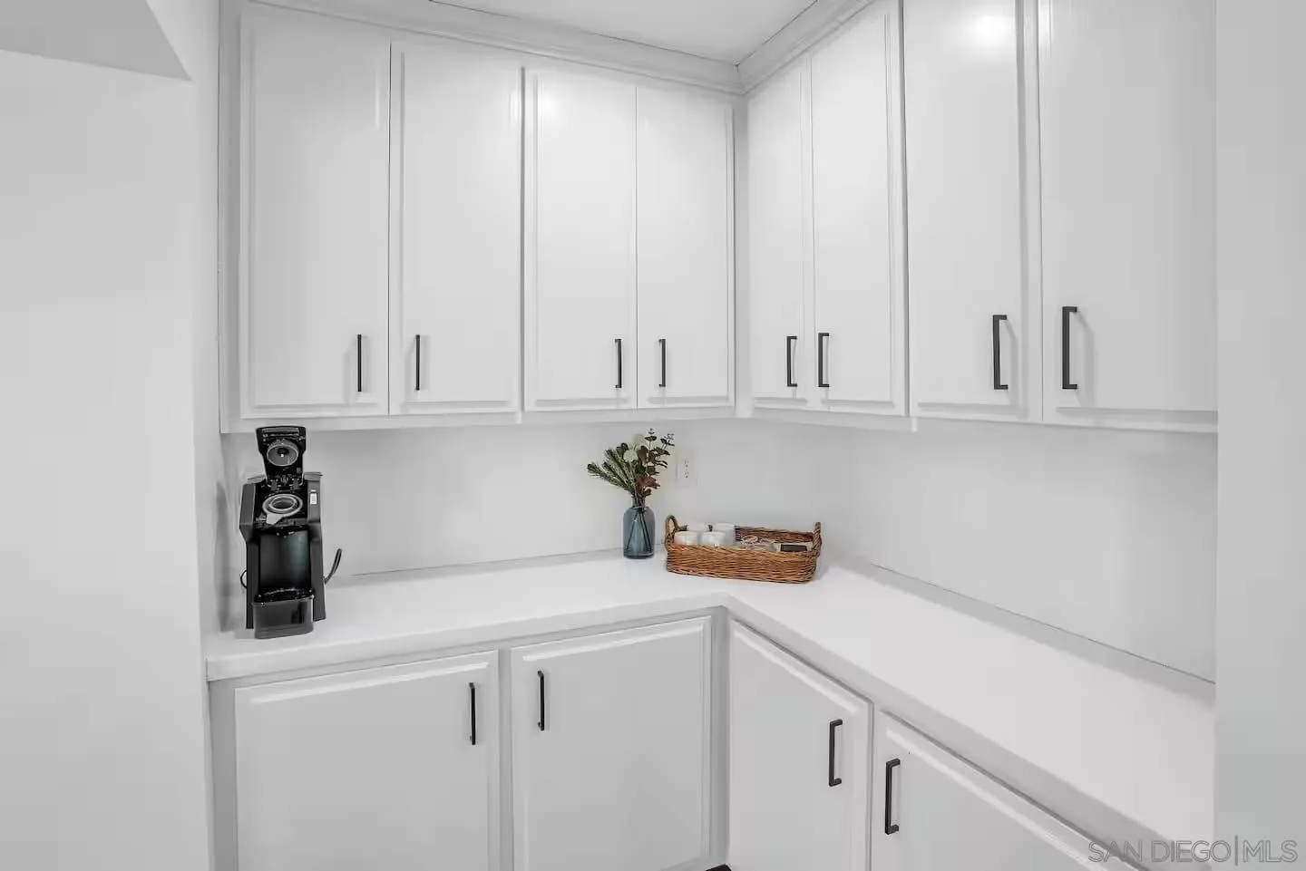3550 Laketree Drive Fallbrook, CA 92028 - Photo 43 of 56 a view of cabinets a sink and dishwasher in a white kitchen