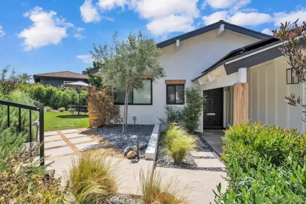 a view of a house with a yard