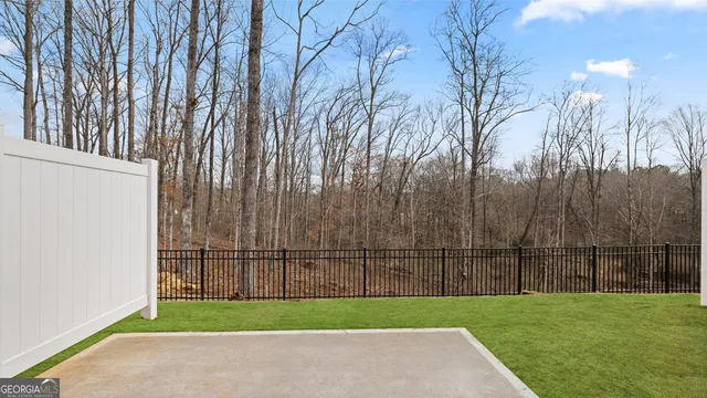 a view of a backyard with grass