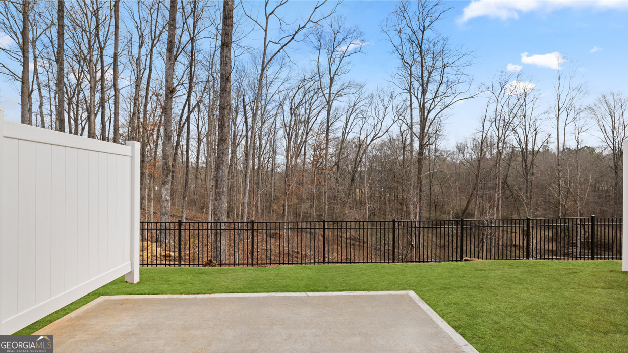 266 Sound Circle Stockbridge, GA 30281 - Photo 16 of 39 a view of a backyard with grass
