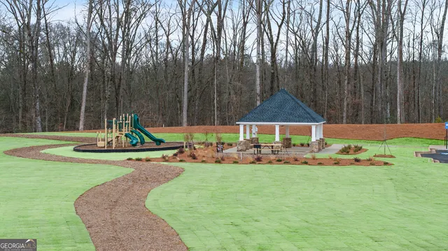 a view of a house with backyard and a slide