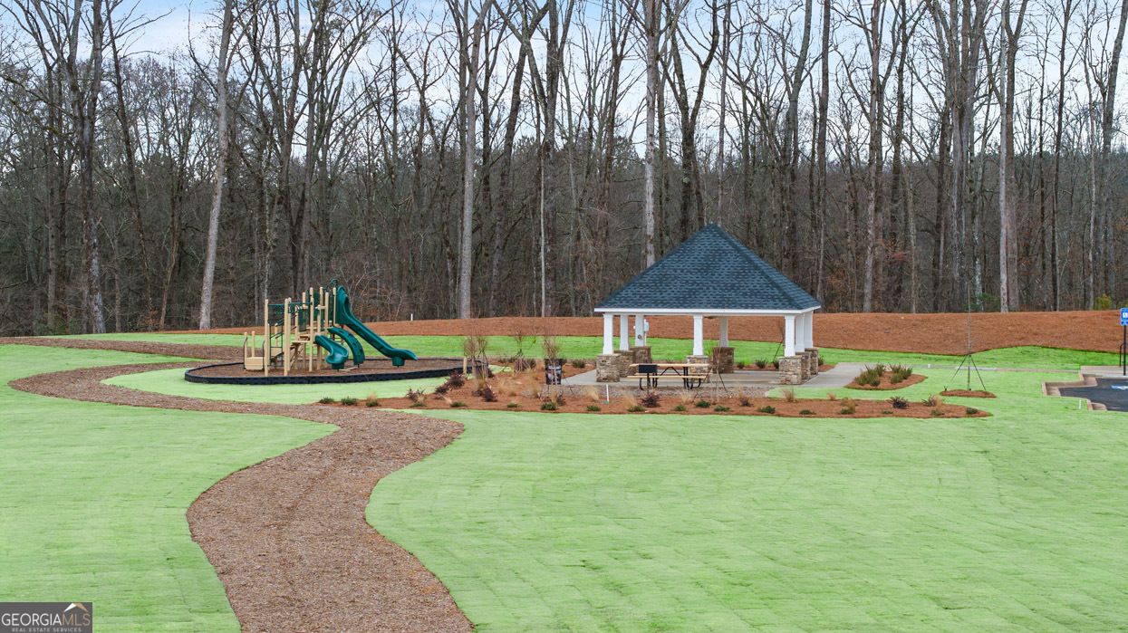 266 Sound Circle Stockbridge, GA 30281 - Photo 26 of 39 a view of a house with backyard and a slide